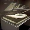 Open table top display case with interior wedged decks for open presentation of Audubon folios.